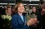 
Moldovan President Maia Sandu celebrates with staff and supporters following preliminary results of the second round of the presidential election in Chisinau November 3. [Daniel Mihailescu/AFP]        