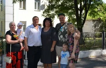 Larisa Kucherenko (center) poses with her mother, husband, son, sister-in-law and grandchildren in Mariupol, Ukraine, August 4, 2017. She was repatriated in a prisoner exchange in October 2022. Her husband and son are still in Russian captivity. [Larisa Kucherenko personal archive]