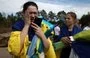 
A Ukrainian servicewoman talks on the phone to her children after her release from Russian captivity at an undisclosed location near the Ukrainian-Belarusian border, on September 13. [Anatolii Stepanov/AFP]        