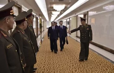 A North Korean army delegation comprised of military education officials led by Kim Kum Chol, president of Kim Il Sung Military University, receives a send-off from military officials before departing to Russia from Pyongyang on July 8. [Kim Won Jin/AFP]