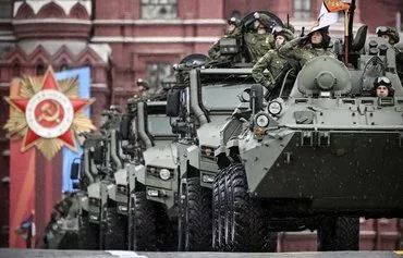 Russian military vehicles move through Red Square during the Victory Day parade in Moscow on May 9. [Alexander Nemenov/AFP]