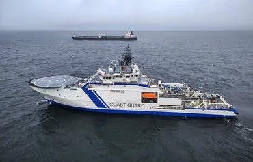 A Finnish coast guard vessel on December 26 after a Russia-linked tanker suspected of severing undersea cables was seized. [Finnish Police/X]