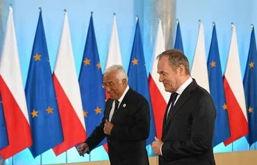 Poland's Prime Minister Donald Tusk (right) receives President of the European Council Antonio Costa in Warsaw on January 3, on the day of the official opening of the Polish presidency of the Council of the European Union. [Sergei Gapon/AFP]