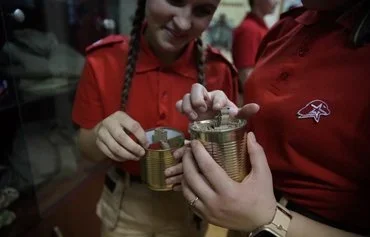 Russian Yunarmiya (Youth Army) cadets hold trench candles at a school museum in Istra, Moscow province, January 24. [Tatyana Makeyeva/AFP]